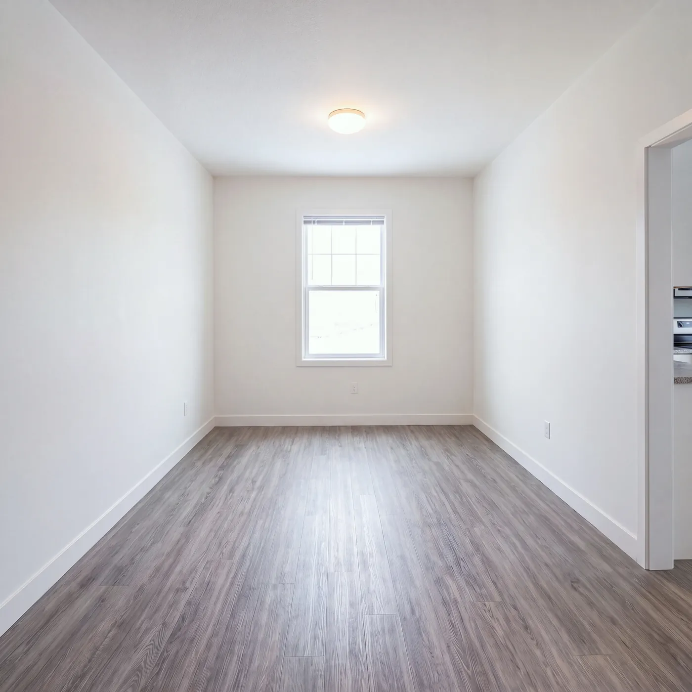 A one-bedroom living room in an affordable community, before staging