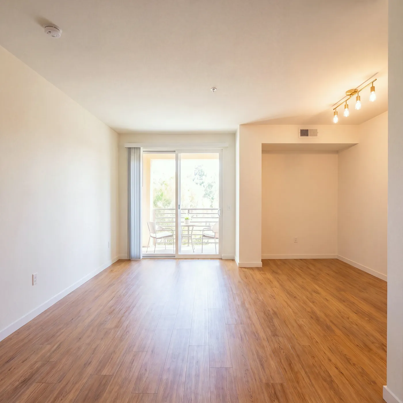 A living and dining room in a garden-style community, before staging